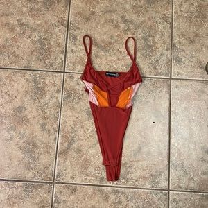 Pretty little thing bodysuit size 2 never worn!